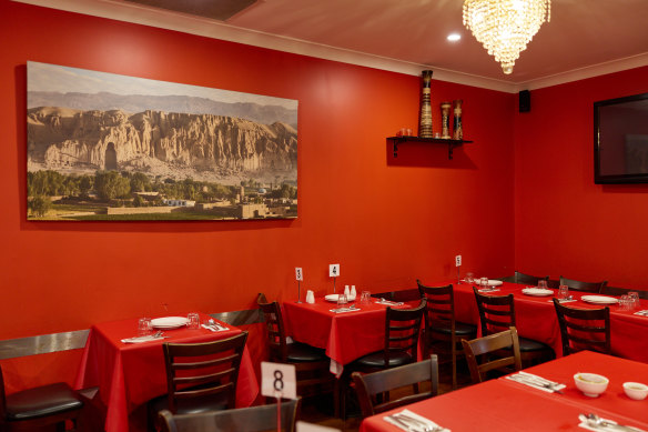 A photo of Bamiyan Valley in Afghanistan takes pride of place on the restaurant’s red walls.