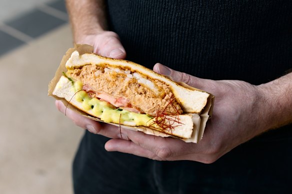 It’s manageable – you can eat it in one hand – but I often find myself eating it with two, elbows on the table, much like I used to when sitting at the kitchen counter as a kid, lost in daydreams.
