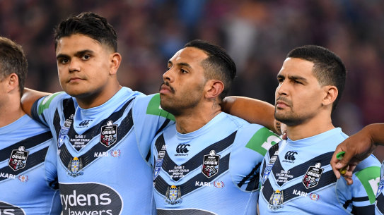 NSW stars Latrell Mitchell, Josh Addo-Carr and Cody Walker during the anthem before the State of Origin last year.