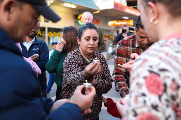 Sirjana Bartaula attends an August 27 candlelight vigil in Rockdale, Sydney for the victims of the floods.