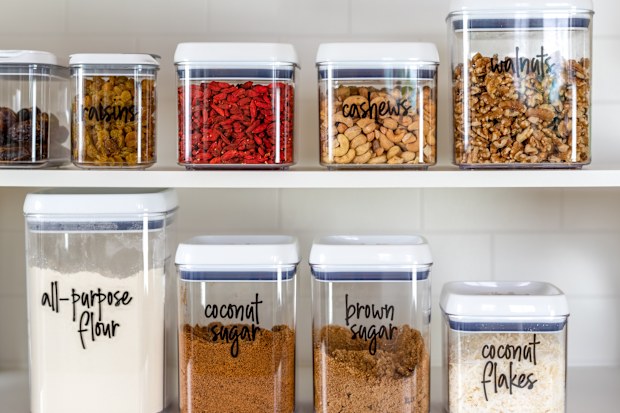 Neatly organized and labeled baking ingredients in BPA-free plastic storage containers