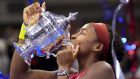 Coco Gauff kissing the trophy.