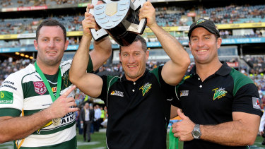 Chris, Ben and Shane Walker celebrate the Jets’ victory in the 2015 state championship final.
