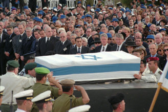 The coffin of late Israeli Premier Yitzhak Rabin lays in Jerusalem’s Herzl Cemetery Monday, November 6, 1995
 in front of world leaders including (from left to right) Spain’s Felipe Gonzalez, France’s Jacques Chirac, 
Britain’s John Major, Britain’s Prince Charles, Germany’s Helmut Kohl and Roman Herzog, 
U.N Secretary General Boutros Boutros-Ghali, Egyptian President Hosni Murbarak, Hilary Clinton, 
President Clinton, Dutch Prime Minister Wim Kok, Dutch Queen Beatrix and Israel’s Shimon Peres.  