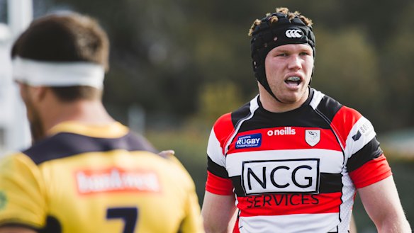 Blake Enever looks on.