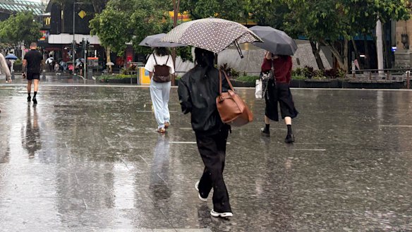 Seasonal rain in Brisbane is causing problems for train commuters.