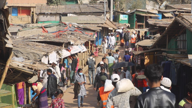 Rohingya refugees walk at the Balukhali refugee camp at Cox’s Bazar.