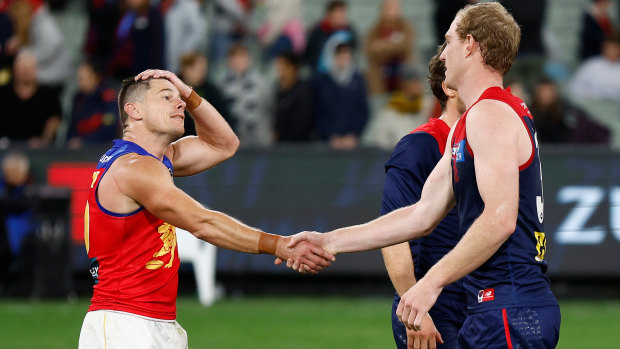 Dayne Zorko and Harrison Petty shakes hands on Thursday night.