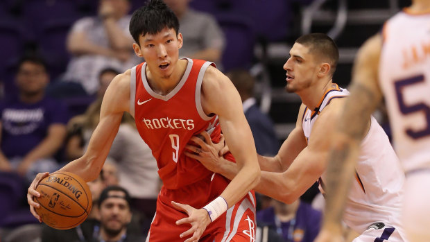 Zhou Qi backs down Alex Len during a Houston Rockets game against the Phoenix Suns in late 2017.