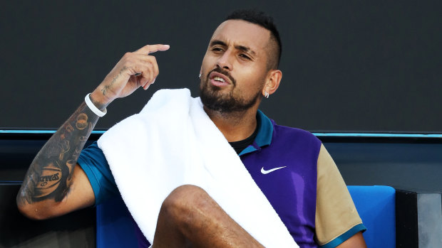 Nick Kyrgios argues with the chair umpire after receiving a time violation.
