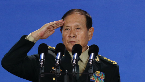 Chinese Defence Minister salutes after delivering his speech at the Xiangshan Forum.