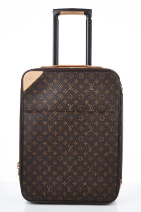 A Louis Vuitton Pegase Legere 55, worth around $5000.