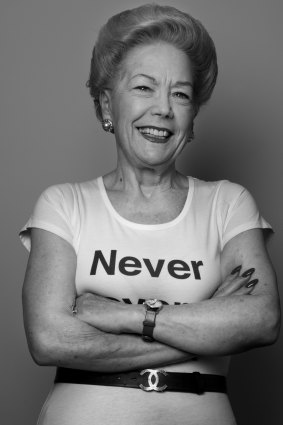 Susan Alberti, Australia's first female registered builder (wearing a T-shirt emblazoned with 'Never give up'), is throwing her clout behind a push to get more girls to consider trades.