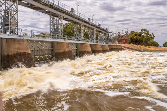 Rising floodwater smash the weir at  Menindee in far western NSW on Friday afternoon.