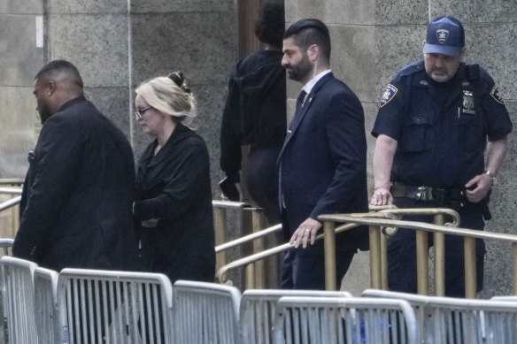 Stormy Daniels, second from left, exits the courthouse in New York.