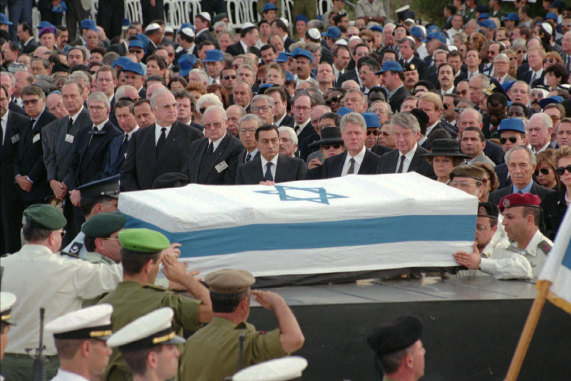 The coffin of late Israeli Premier Yitzhak Rabin lays in Jerusalem’s Herzl Cemetery Monday, November 6, 1995
 in front of world leaders including (from left to right) Spain’s Felipe Gonzalez, France’s Jacques Chirac, 
Britain’s John Major, Britain’s Prince Charles, Germany’s Helmut Kohl and Roman Herzog, 
U.N Secretary General Boutros Boutros-Ghali, Egyptian President Hosni Murbarak, Hilary Clinton, 
President Clinton, Dutch Prime Minister Wim Kok, Dutch Queen Beatrix and Israel’s Shimon Peres.  