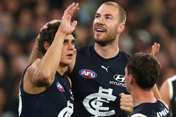 Charlie Curnow of the Blues is congratulated by team mates after kicking a goal.