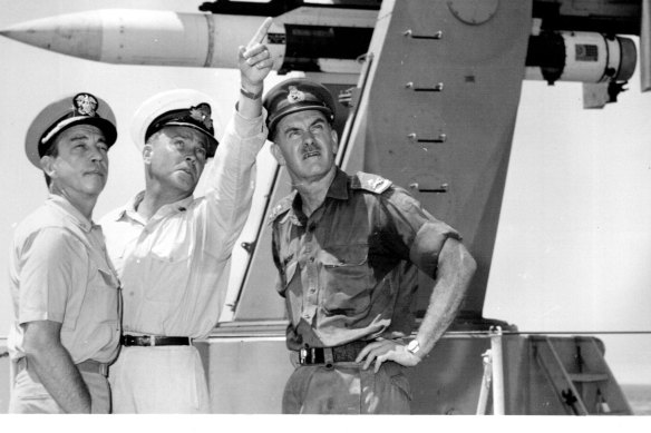 Captain Guy Griffith, centre, on board the HMAS Hobart with Commander of Task Force 77, Rear Admiral R.W. Mehle, and Commander of the Australian Force in Vietnam, Major General D. Vincent in 1967.