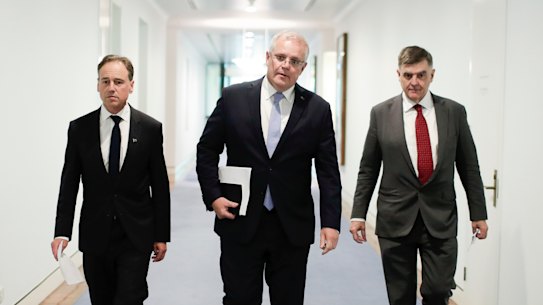 Health Minister Greg Hunt (left), Prime Minister Scott Morrison and Chief Medical Officer Professor Brendan Murphy in early March.