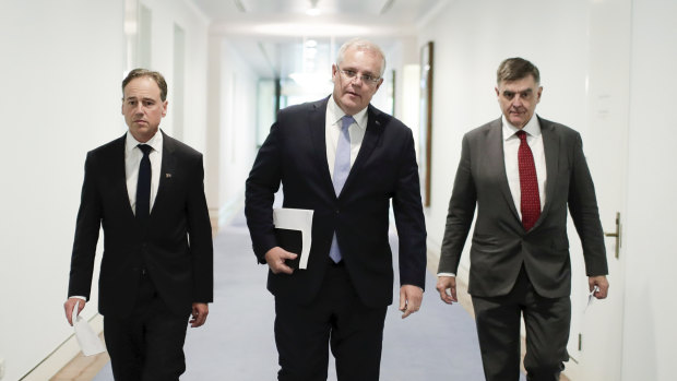 Health Minister Greg Hunt (left), Prime Minister Scott Morrison and Chief Medical Officer Professor Brendan Murphy in early March.