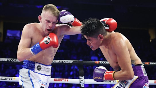 Liam Wilson (left) and Emanuel Navarrete exchange punches.
