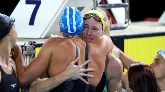 Cate Campbell is surrounded by her fellow competitors after swimming the final of the women’s 50m freestyle.