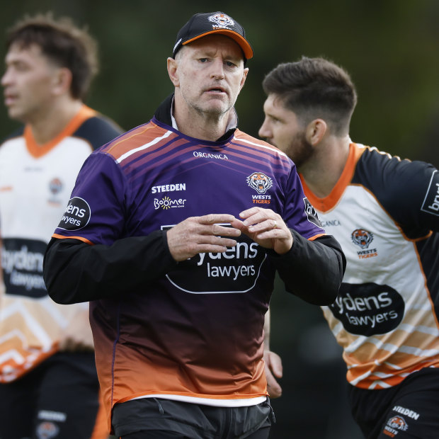 Wests Tigers coach Michael Maguire runs his eye over the team at training.