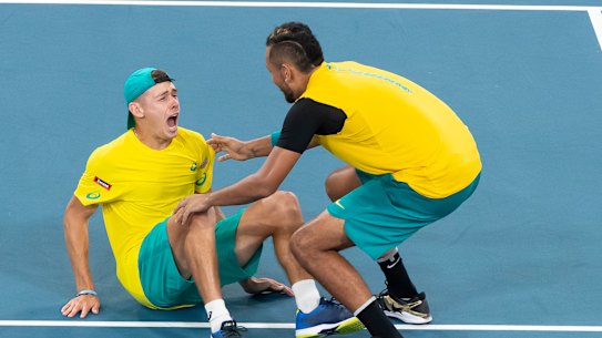 Alex De Minaur and Nick Kyrgios celebrate their epic doubles win over Great Britain at Ken Rosewall Arena.