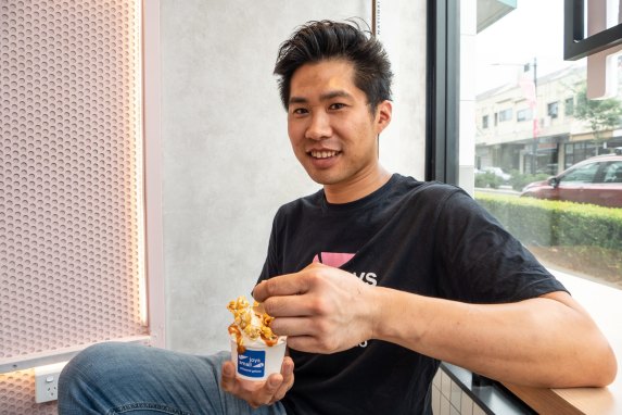 Small Joys owner and chef Terrence Seeto with a scoop of his popcorn miso caramel gelato.