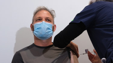 Chief Health Officer Brett Sutton receives the vaccine at the Royal Exhibition Building.