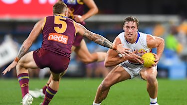 Roarke Smith looks to evade Mitch Robinson.