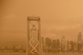 Smoke from the California wildfires hangs over San Francisco bridge.