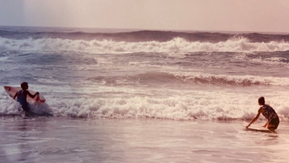 Markus Zusak and his brother at Elouera Beach. Thirty-seven years after Zusak popped up on his first wave here, he continues to surf.