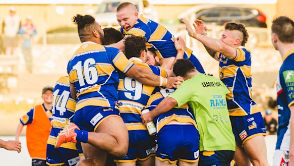 The Rams celebrate the end to a 22-year premiership drought.