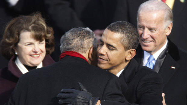 Barack Obama embraces civil rights icon the Reverend Joseph E. Lowery during his inauguration as the 44th president of the US.