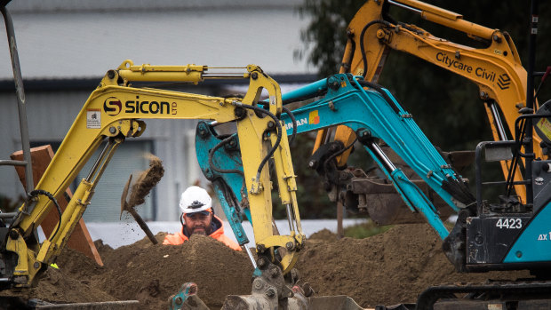 Multiple graves being dug at the Memorial Park Cemetery.