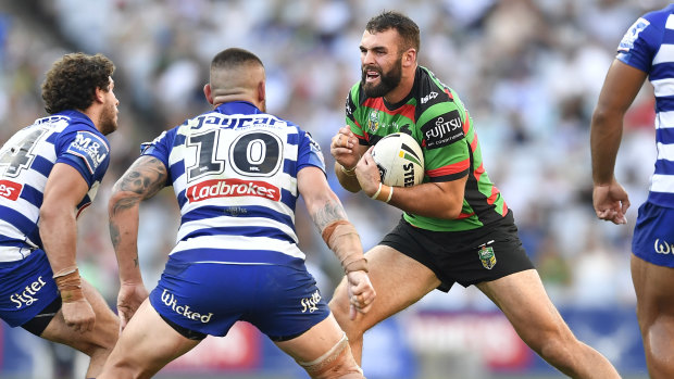 Making his mark: Nicholls hits the ball up for South Sydney.
