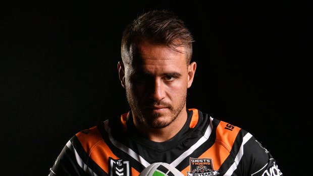 The Wests Tigers say they aware of the charge against Reynolds, who "vigorously denies" the claims. 