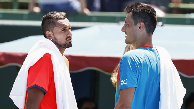 Nick Kyrgios (left) and Bernard Tomic chat after the game.