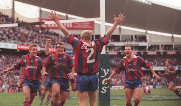 Iconic: Darren Albert scores for the Knights to win the 1997 grand final at the SFS.