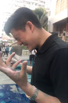 Jeremy Tam moments after being hit with chemical-infused water spray outside the Kowloon Masjid and Islamic Centre, October 20, 2019.