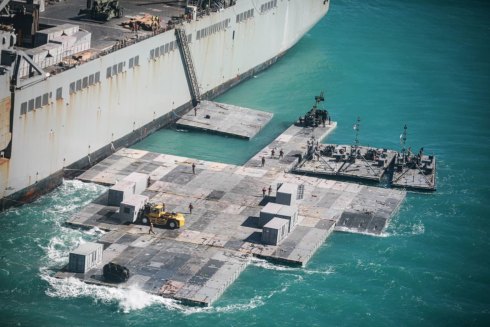 Army engineers construct a causeway  off the coast of Bowen, Australia, 2023.