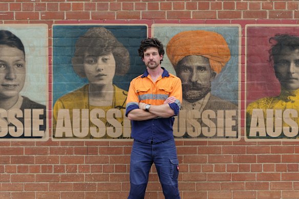 Adelaide artist Peter Drew with his new series of “Aussie” posters.