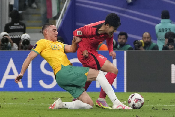 Lewis Miller fouls Son Heung-min in the Asian Cup quarter-final.