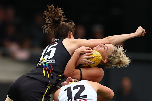Hosking hangs onto the ball under extreme pressure.