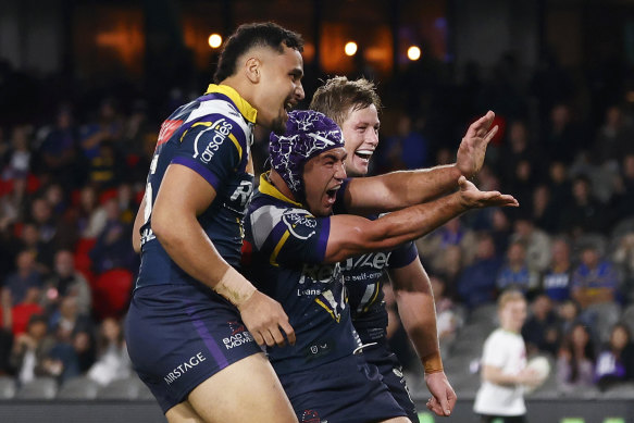 Jahrome Hughes celebrates a Storm try at Marvel Stadium.