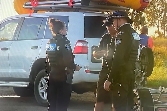 Police at Burnett Heads, north of Bundaberg, where a man was reported missing as the floodwater receded.