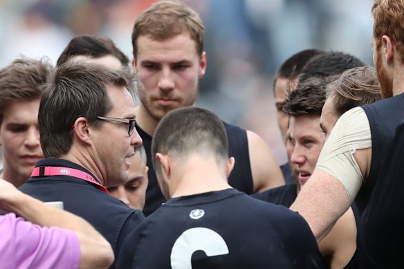 David Teague with players during round 19 last year. 