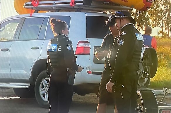 Police at Burnett Heads, north of Bundaberg, where a man was reported missing as the floodwater receded.
