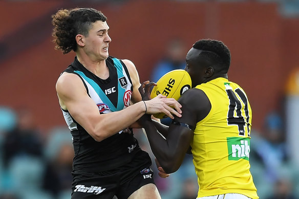 Richmond's Mabior Chol, right, in action against Port Adelaide on Saturday. 